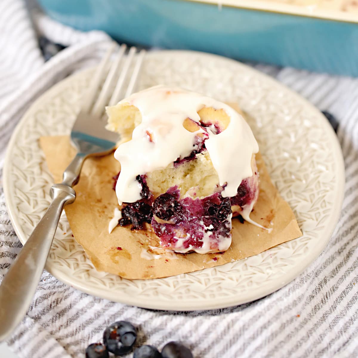 plate with slice of Blueberry Cinnamon Rolls