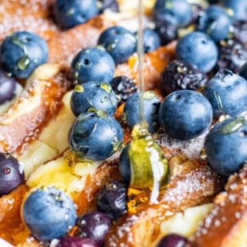 French toast topped with blueberries and syrup.