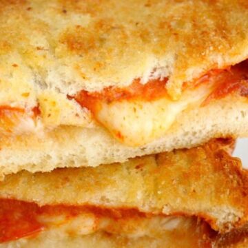 Close-up of a grilled cheese sandwich with melted cheese and pepperoni between toasted bread slices—perfect for fun meal planning or creative lunch recipes.