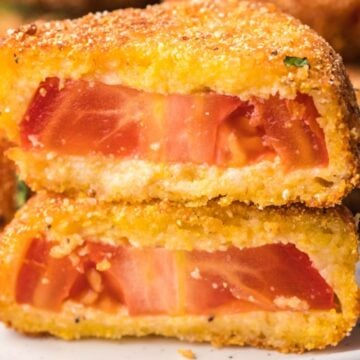 A fried tomato cut in half.