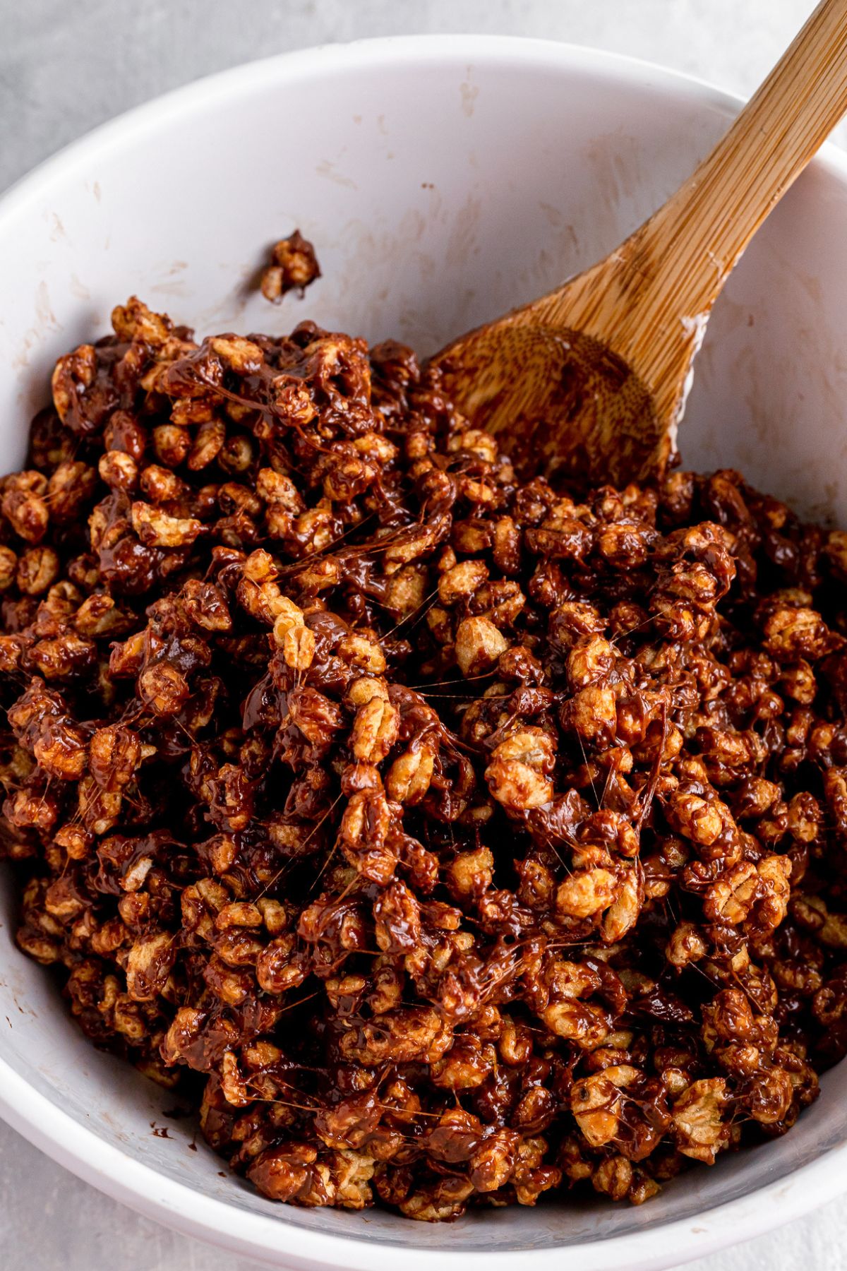 Golden crisp cereal added to the melted ingredients.