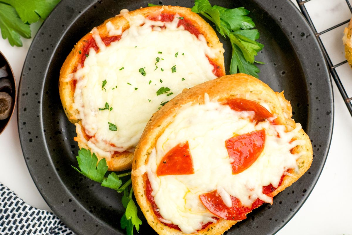 Two pizzas on a plate.