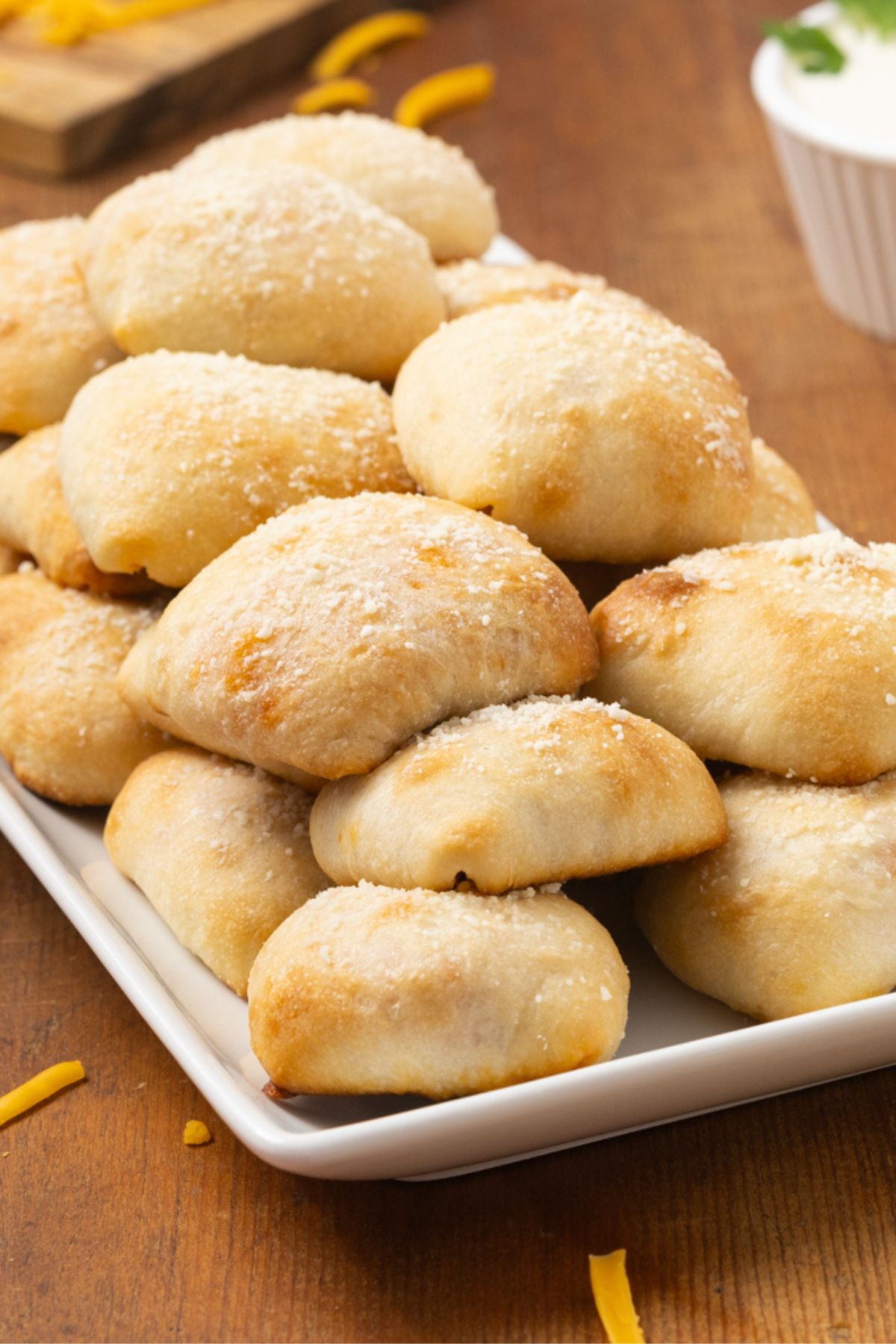 A long serving plate full of buffalo chicken bites.