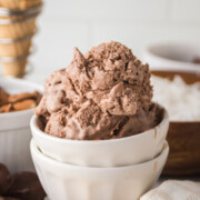 Almond Joy ice cream scooped in a white bowl.