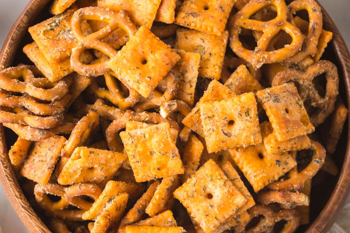 A bowl full of snack mix.