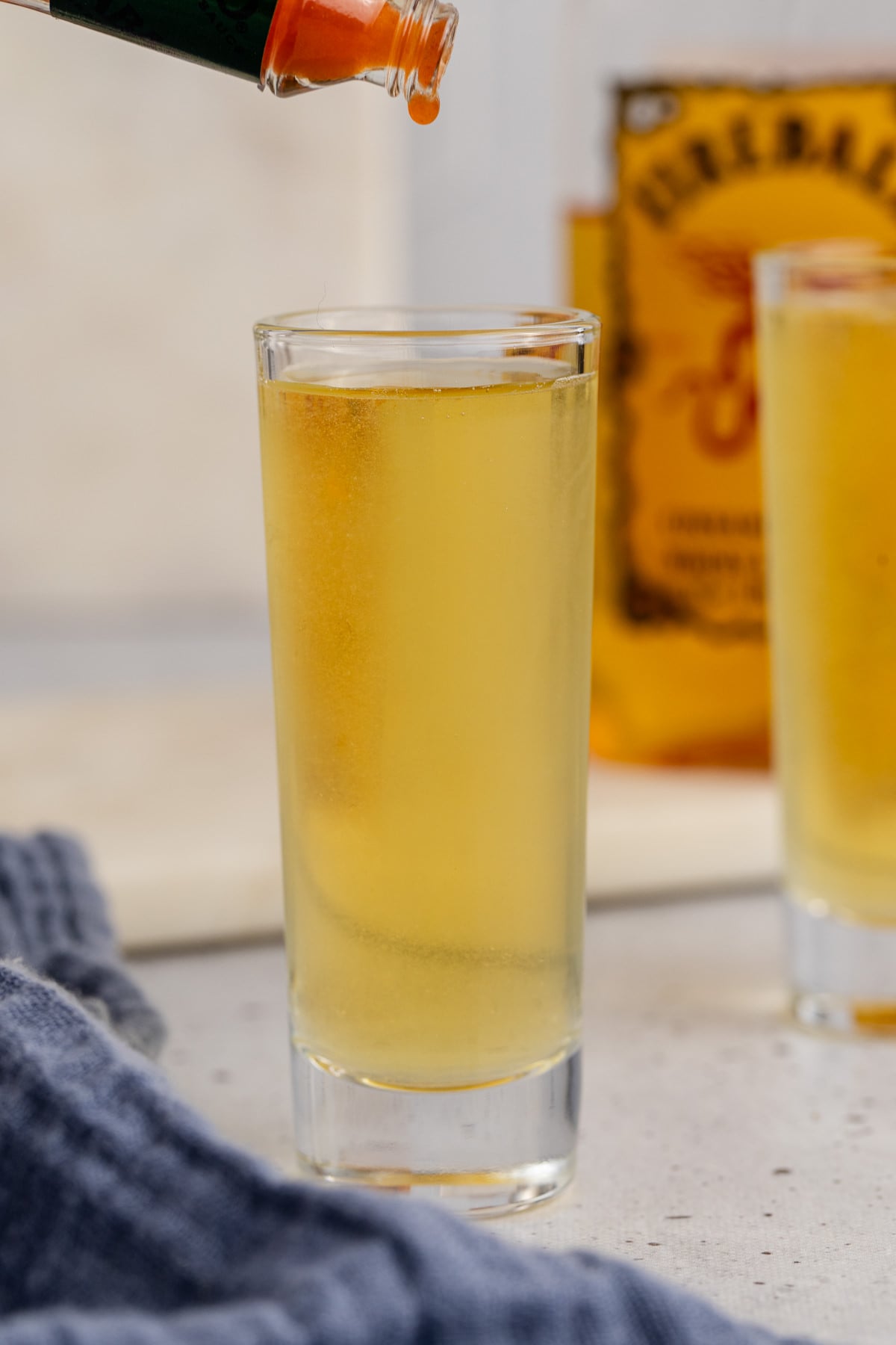 Cocktail shaker poured into shot glass.