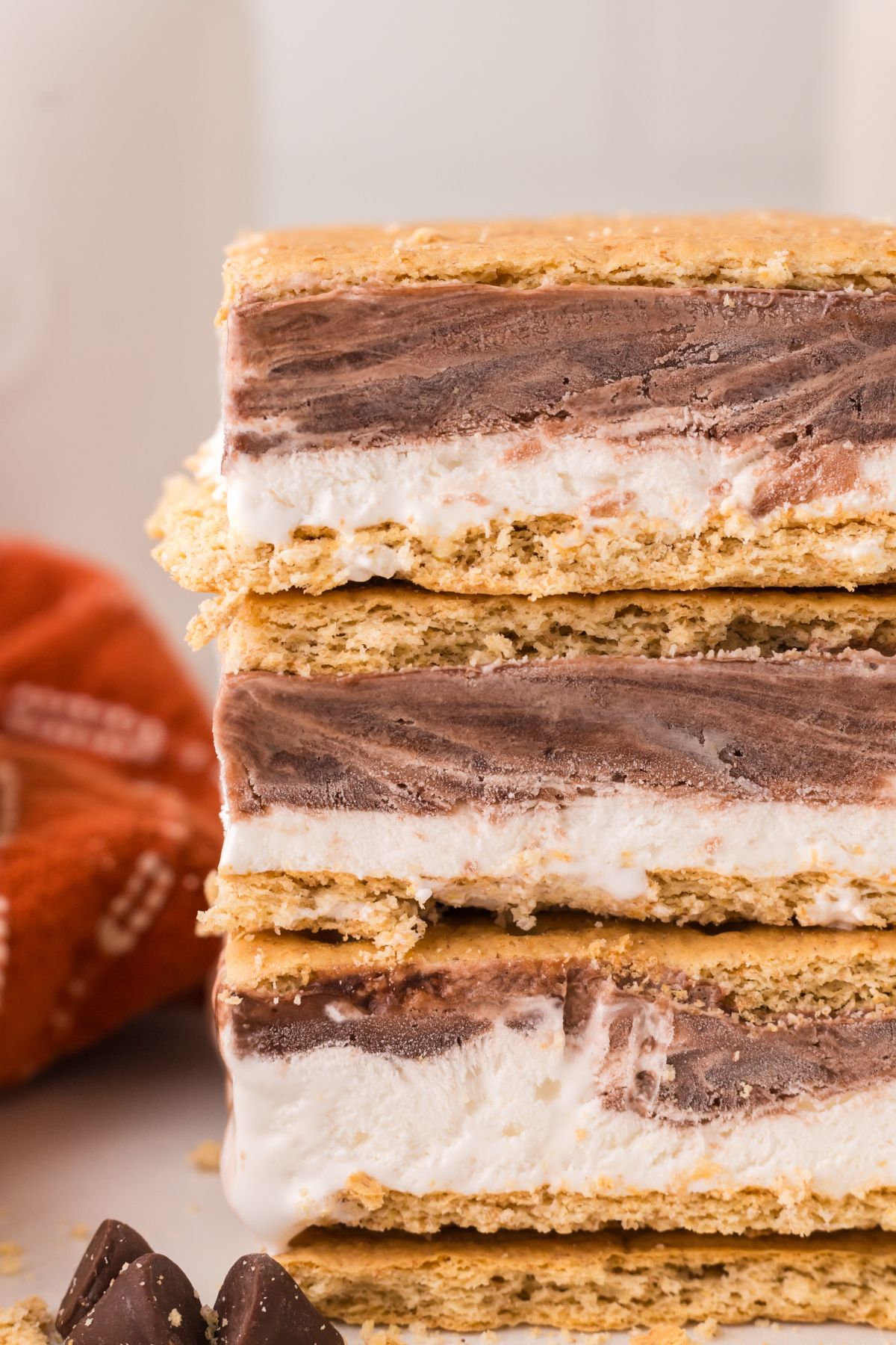 Frozen s’mores stacked with graham crackers, chocolate and marshmallows.