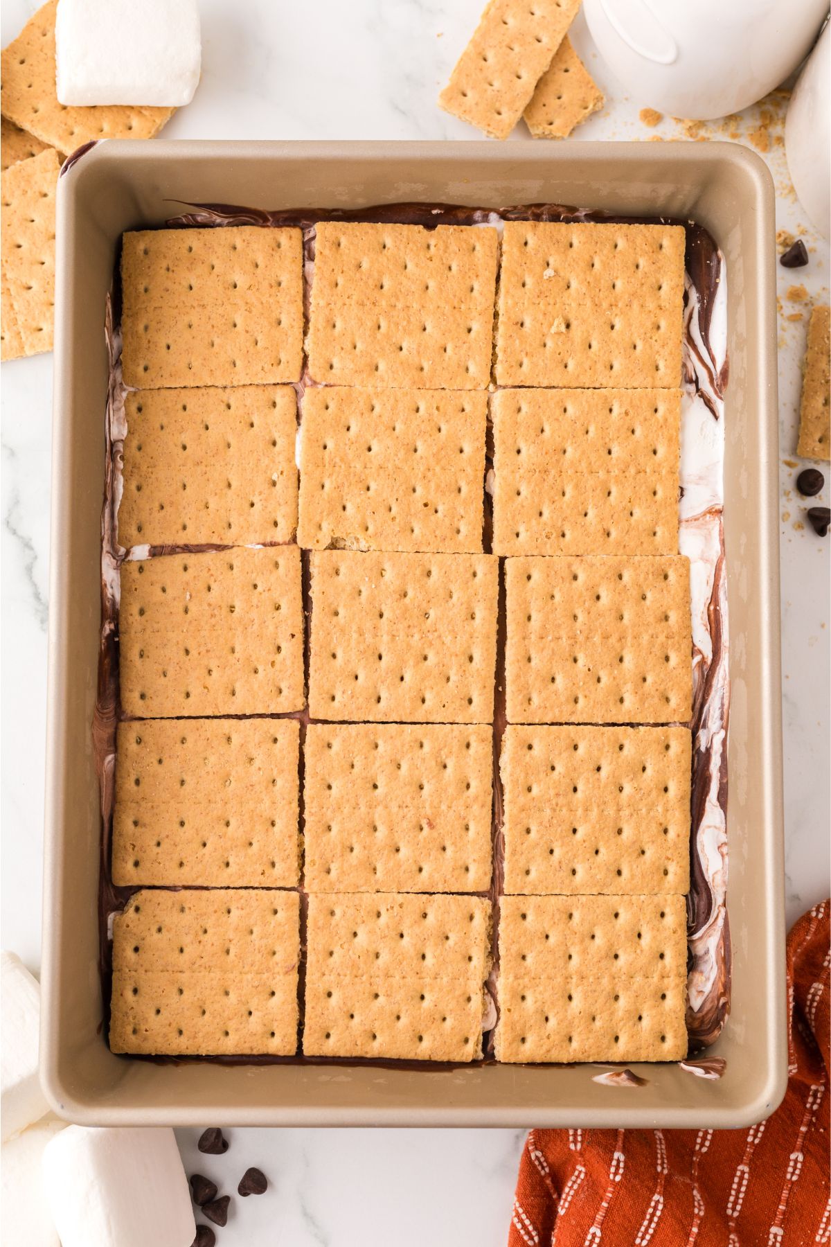 Graham crackers on top of the two mixtures.