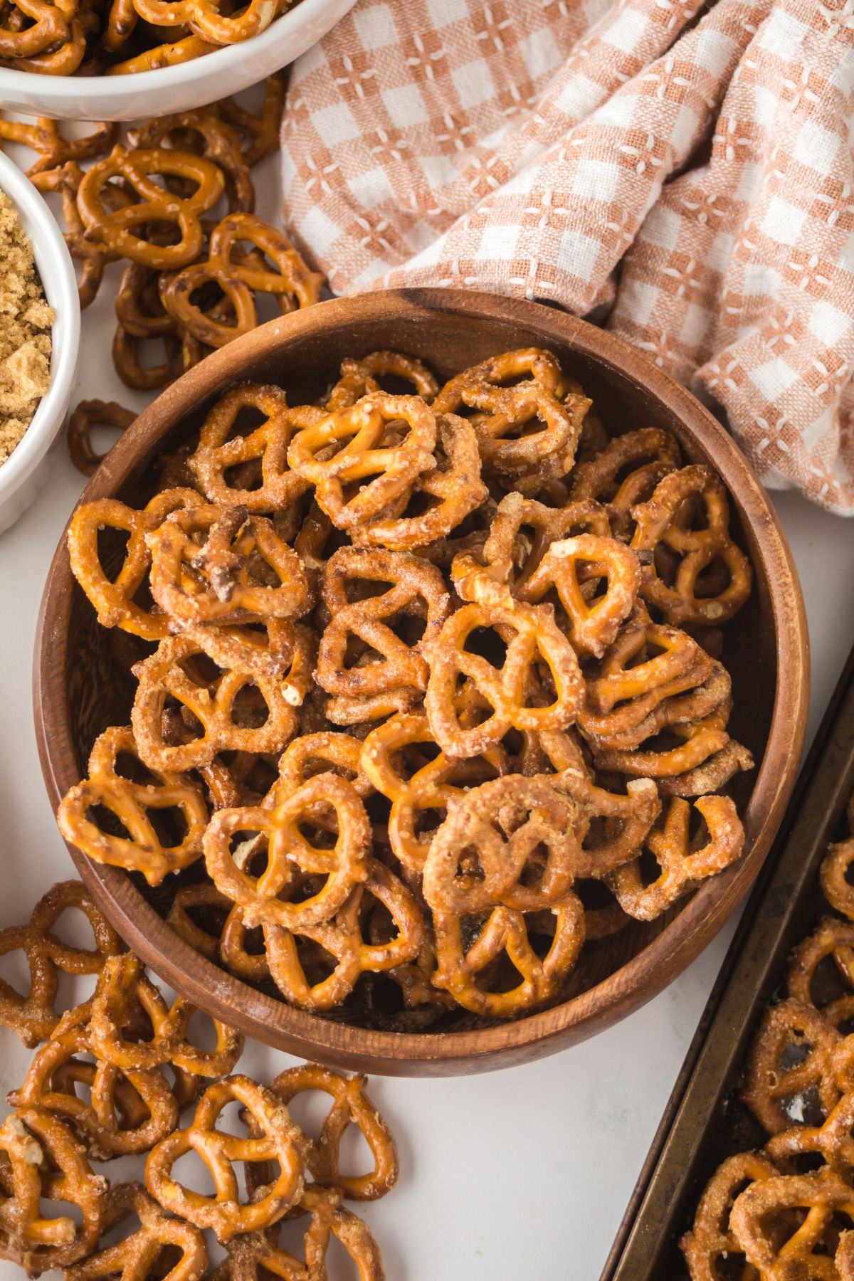 A wooden bowl full of maple pretzels recipe baked.