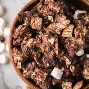 A bowl full of s'mores snack mix on table.