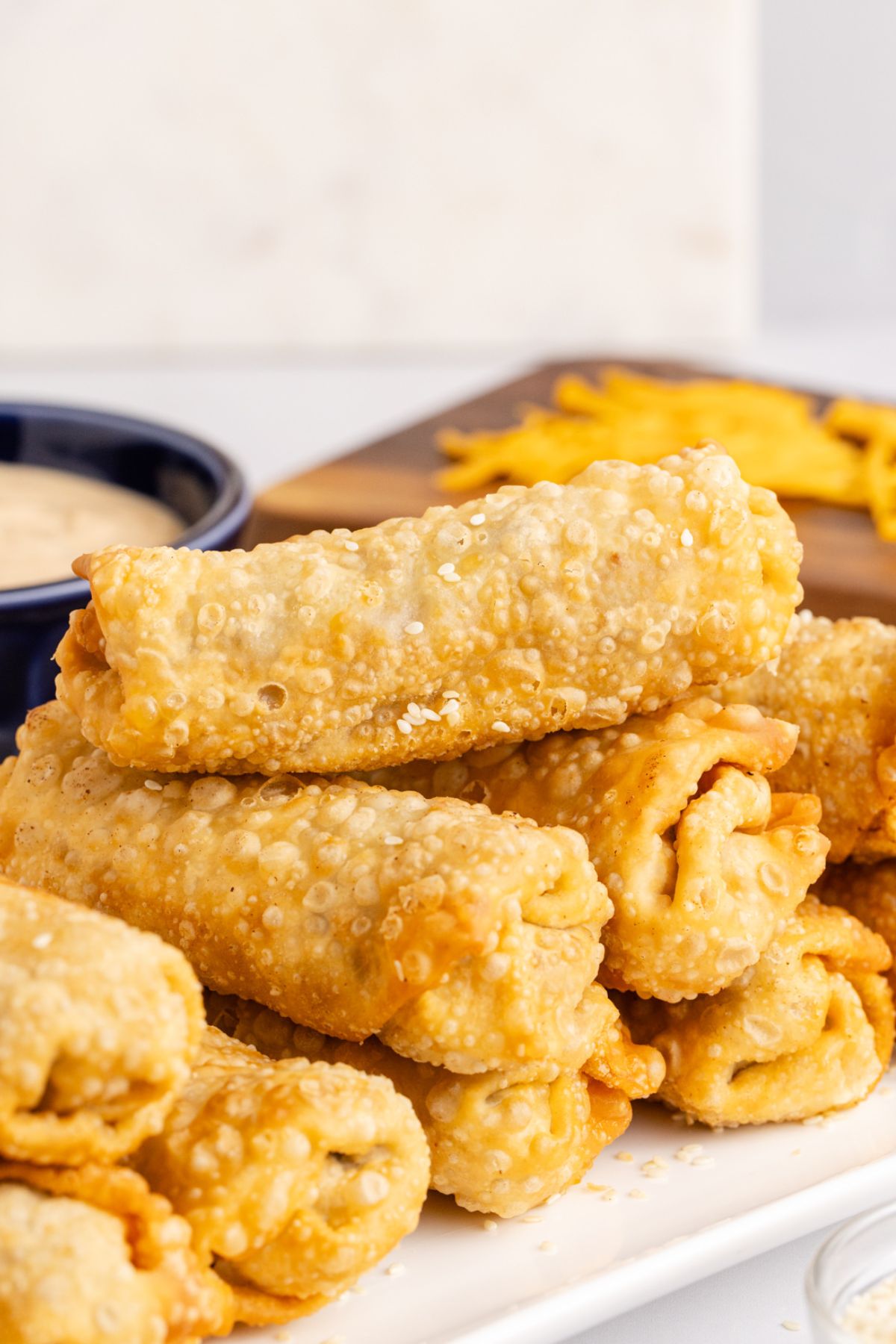 Egg rolls stacked on top of one another.