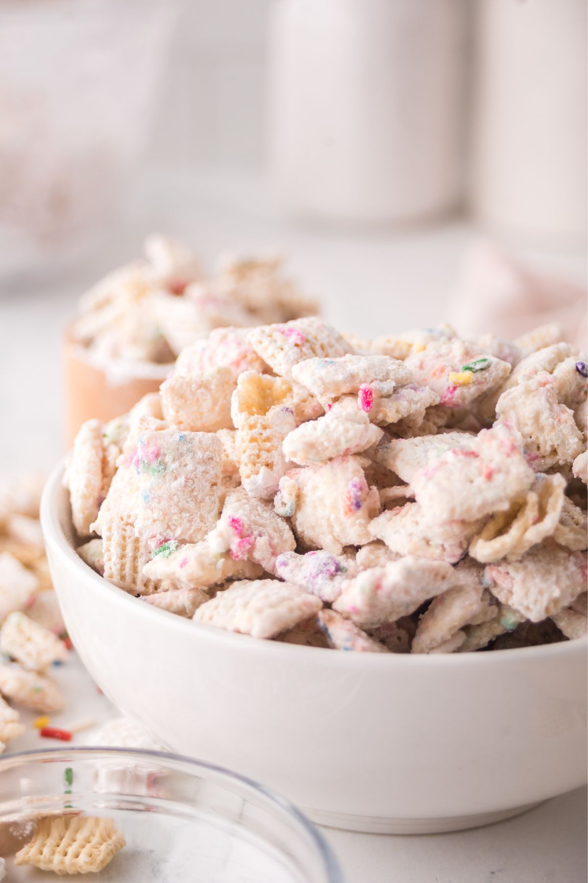 Birthday cake chex mix in a bowl.