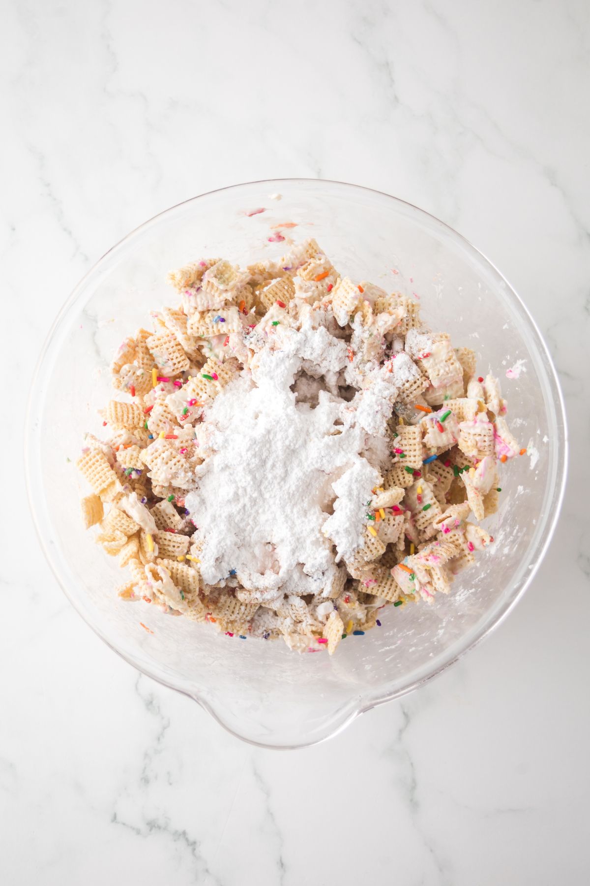Large bowl with powdered sugar ready to be folded in.