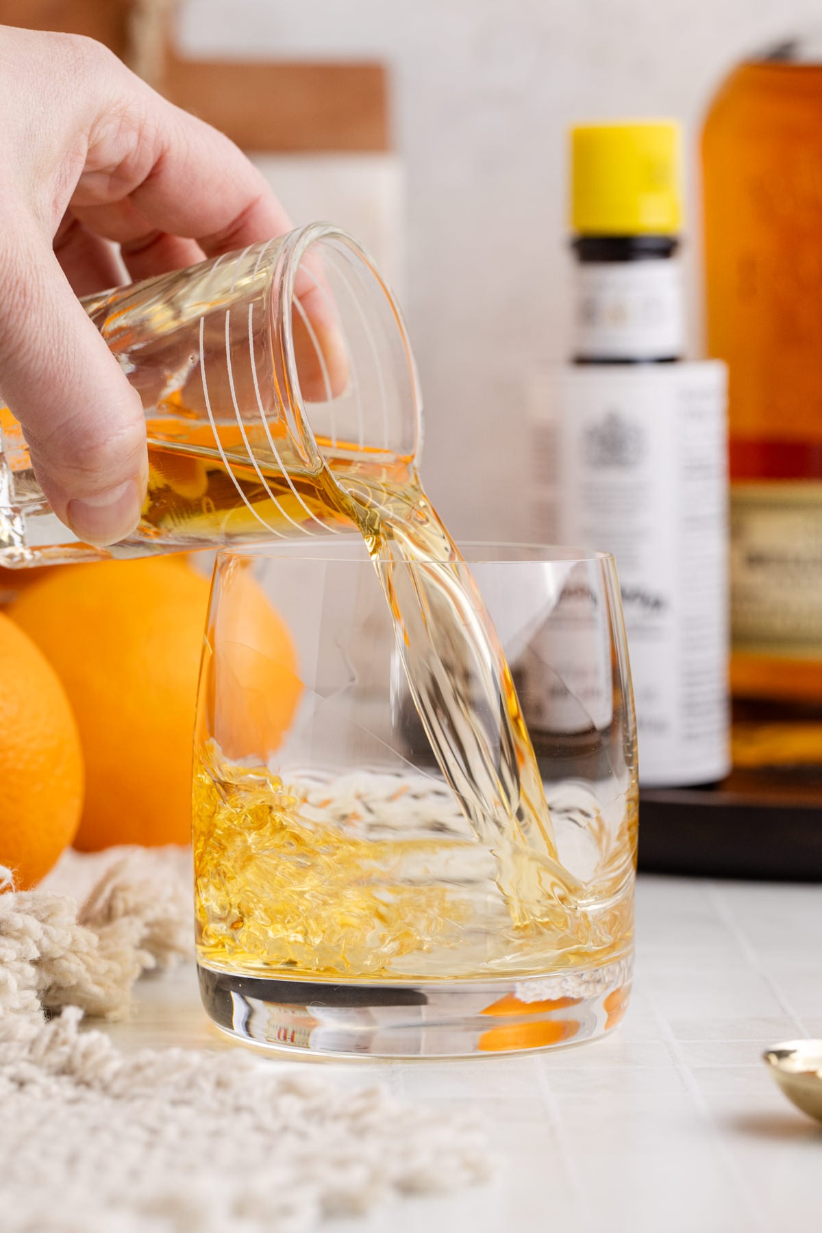 Ingredients being added to glass.