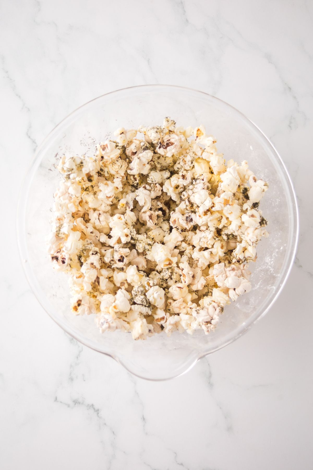 Tossed popcorn in a bowl.