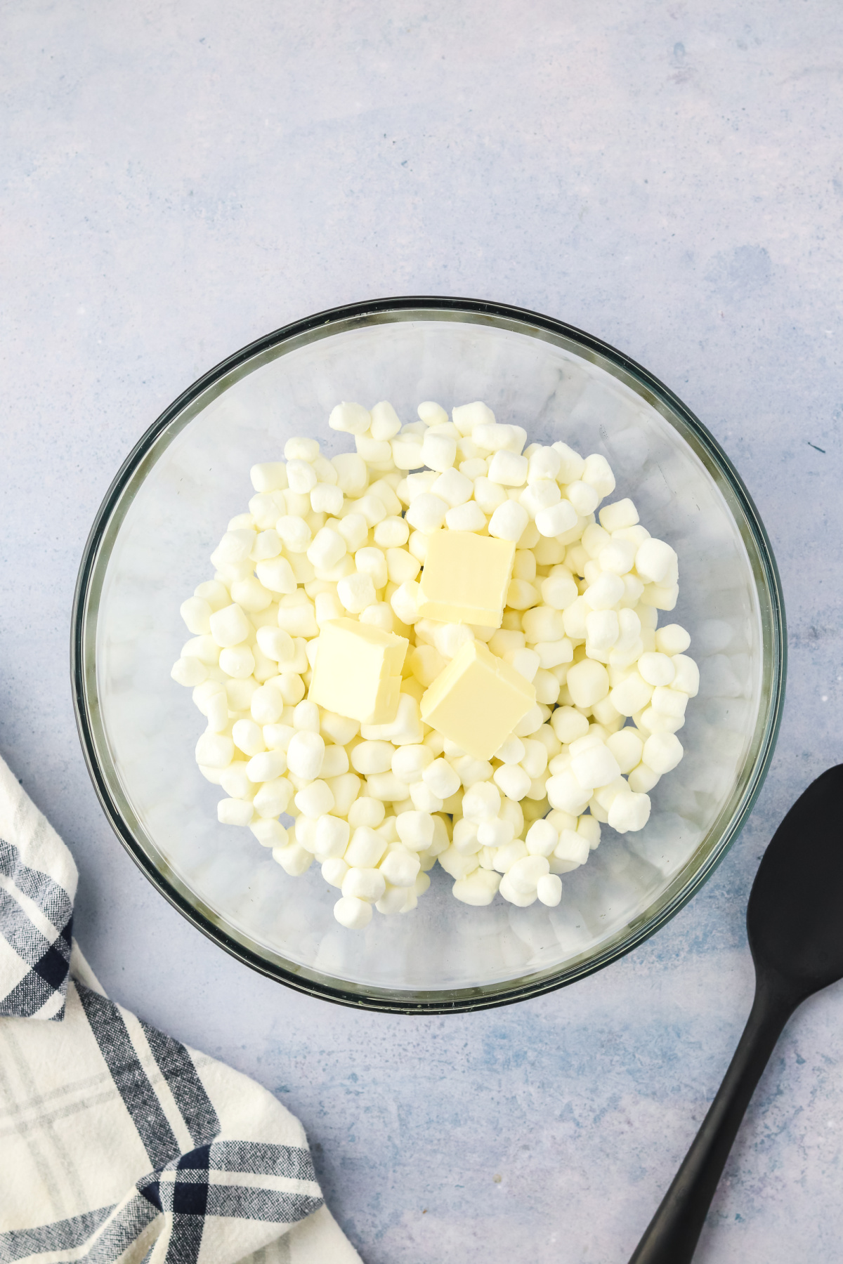 Butter and marshmallows in a mixing bowl.