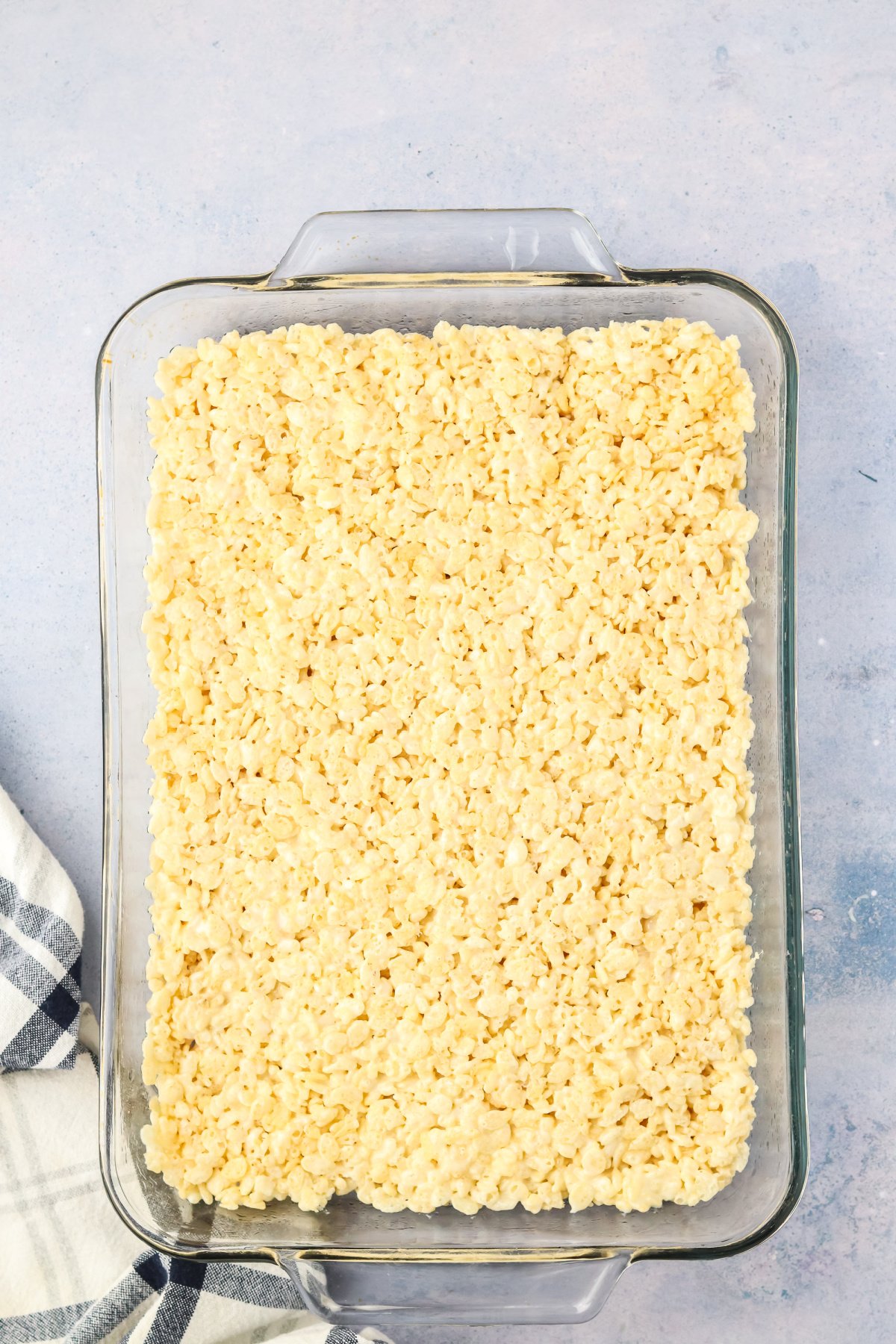 Rice krispie treats pressed into a pan.