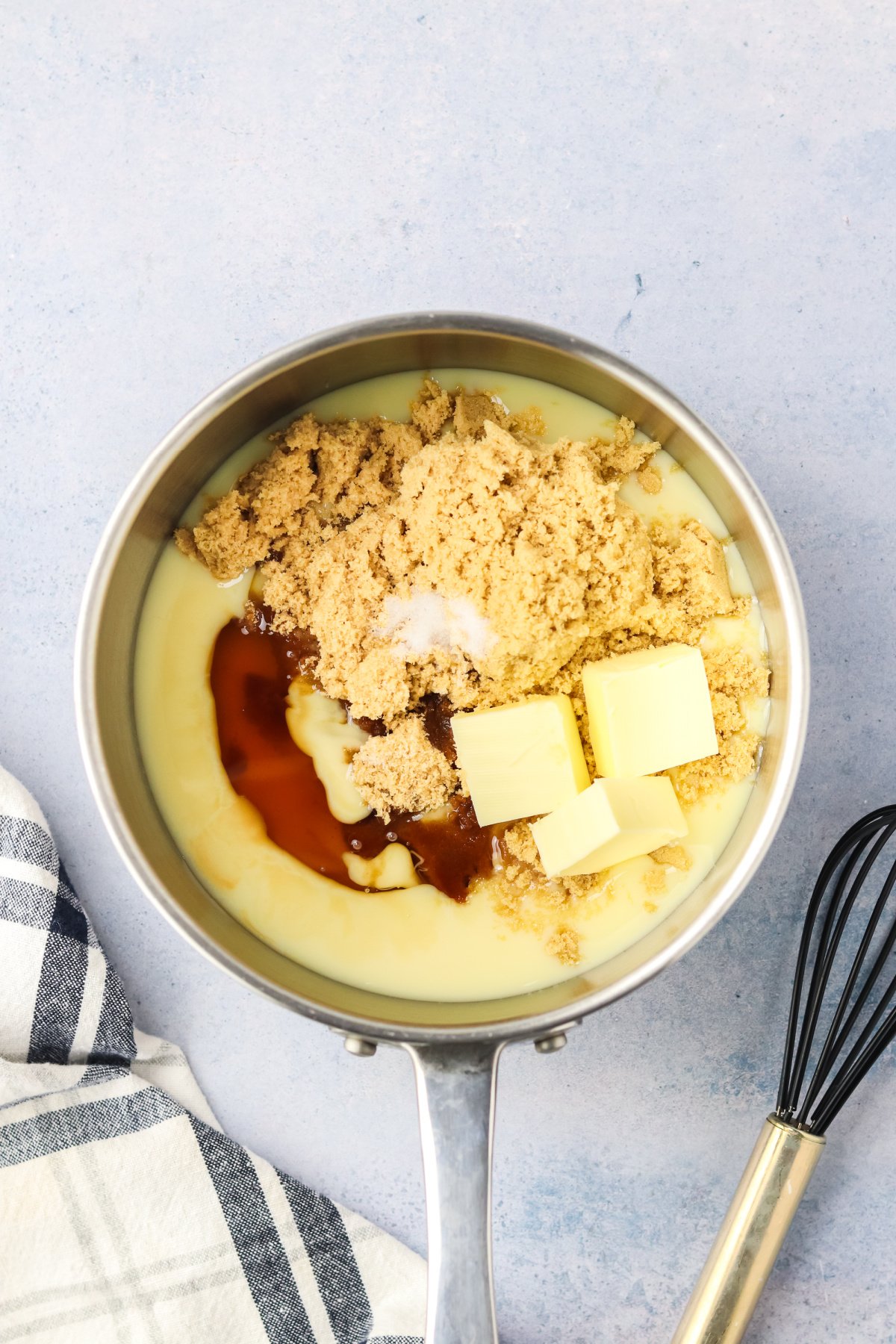 Sweetened condensed milk, butter, brown sugar, corn syrup, vanilla extract and salt in a saucepan.