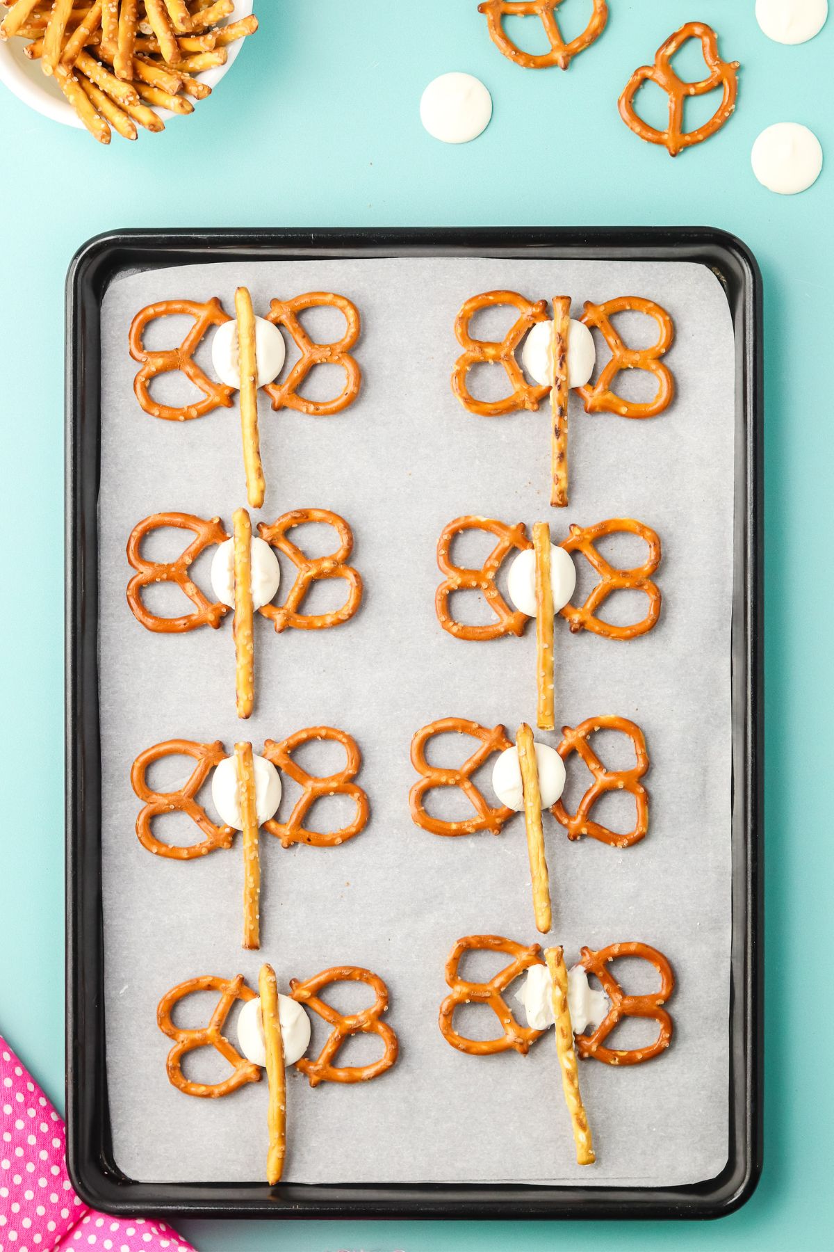 A pretzel stick on top of each candy melt to create the butterfly’s body