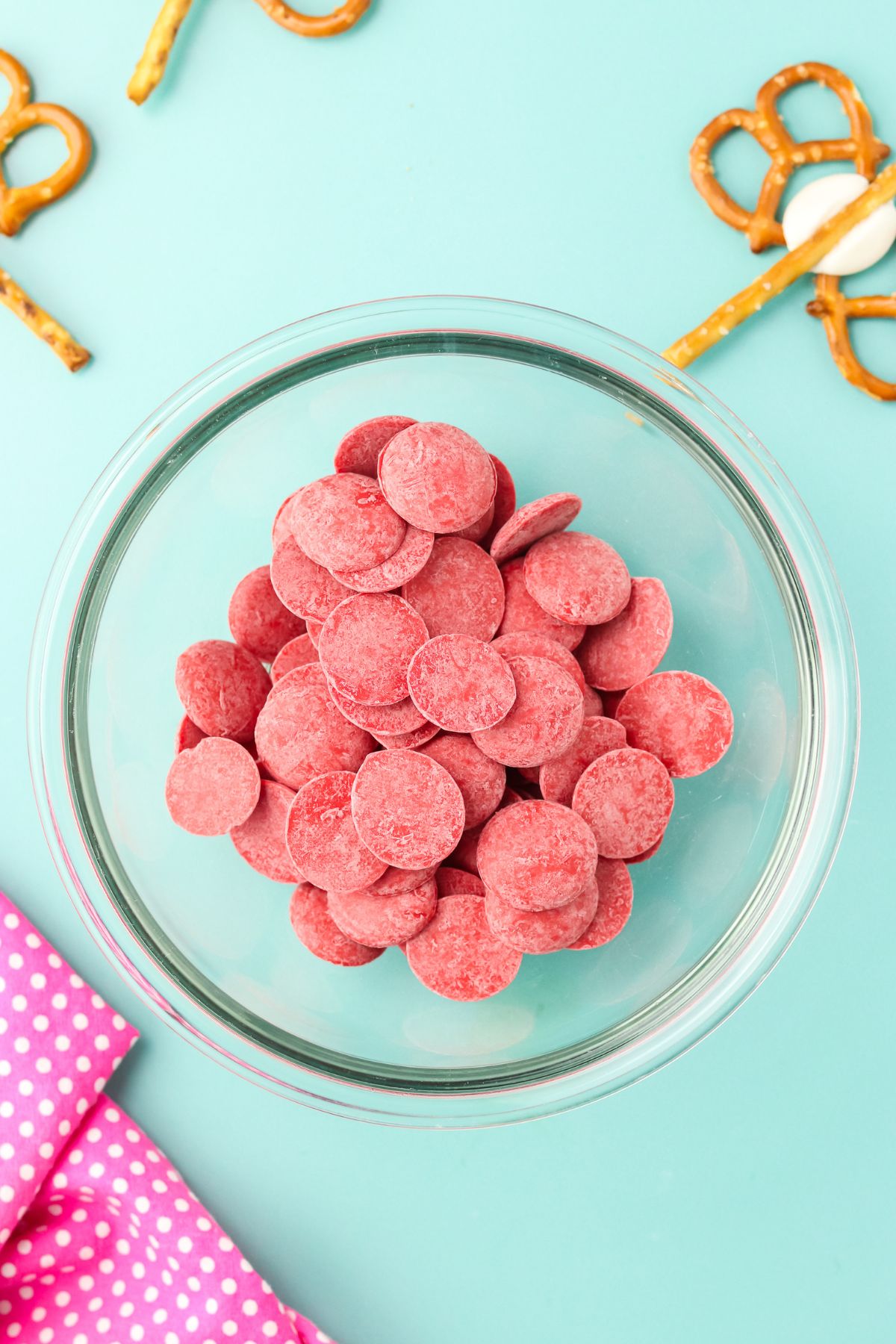 Red candy melts in a bowl.