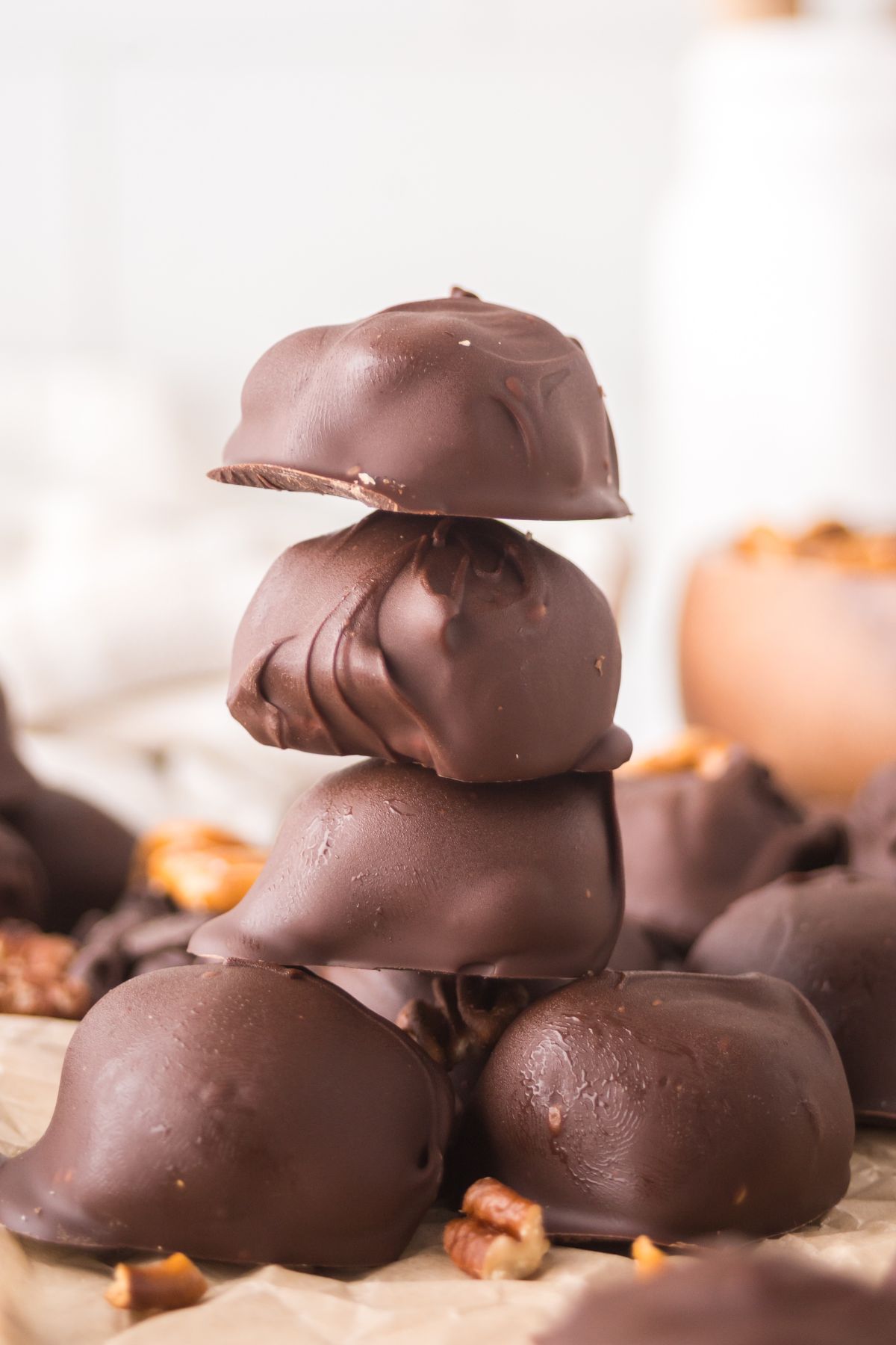 Chocolate candies stacked on top of one another.