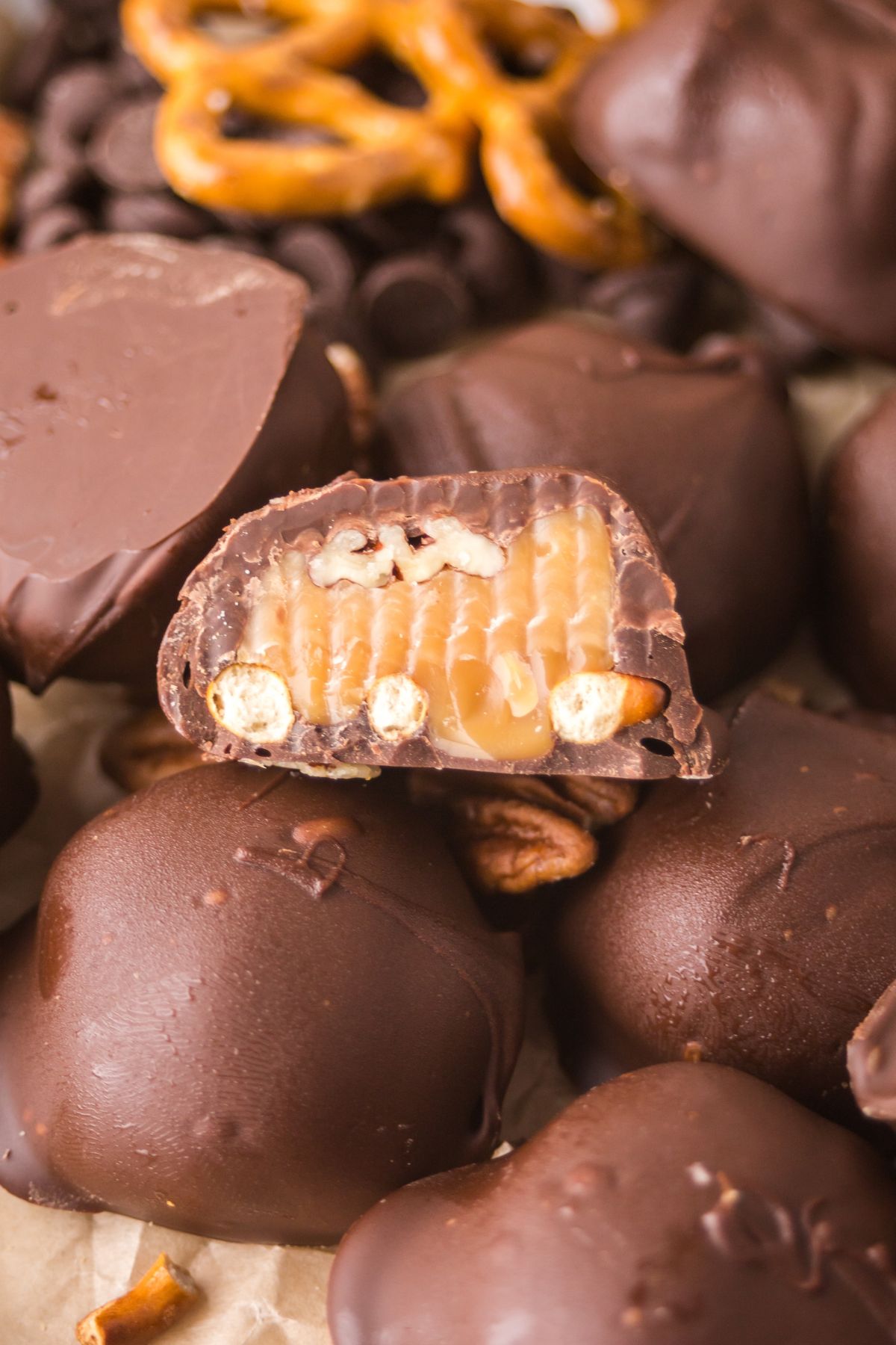 A half of a chocolate caramel stacked on top of other.