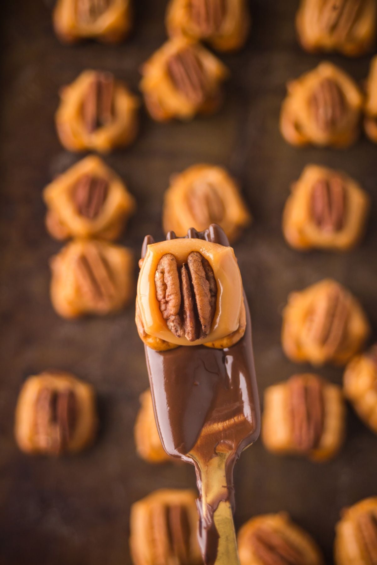 Pecan halves placed onto each caramel.
