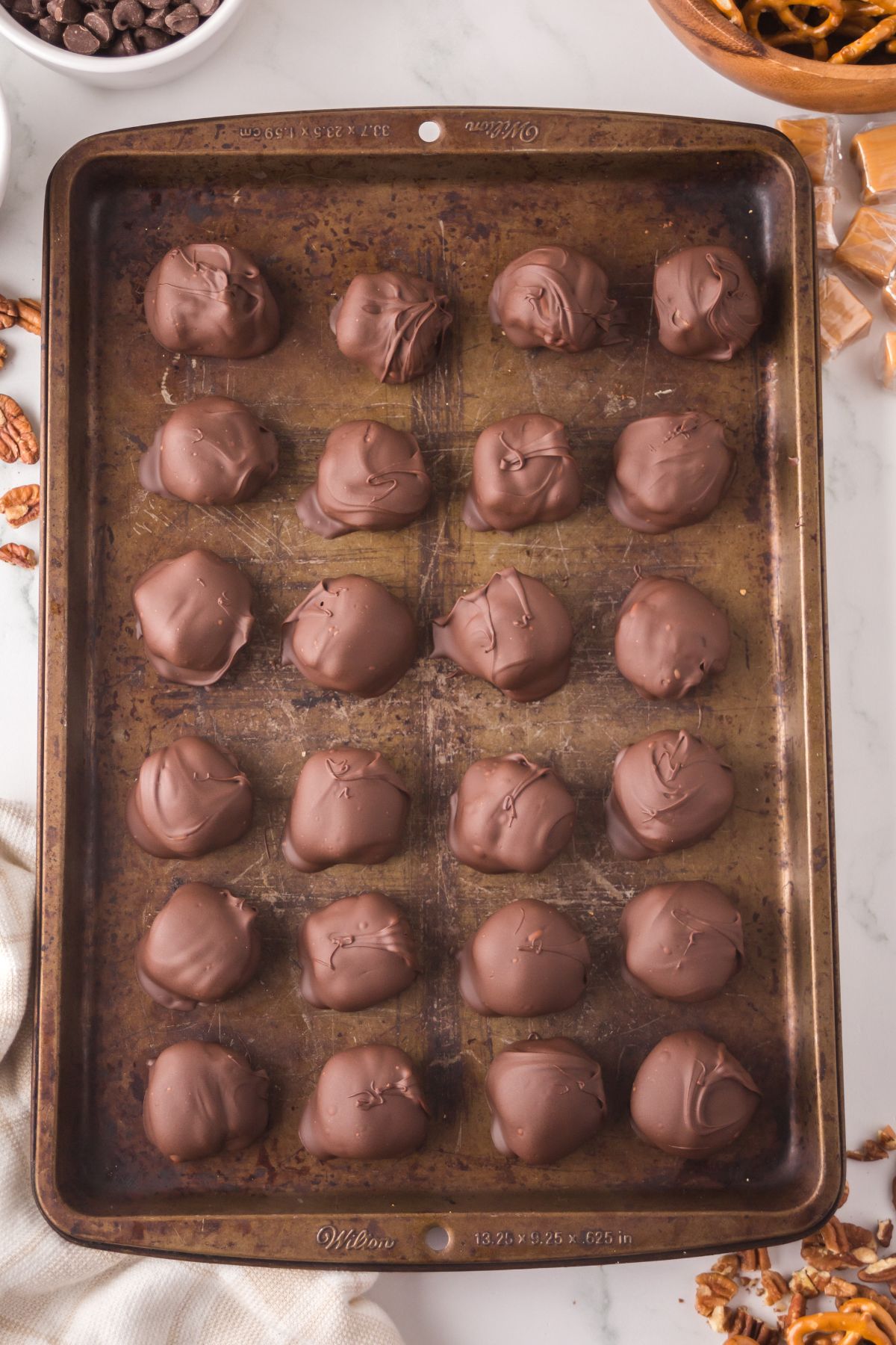 Pretzel turtles coated in chocolate.