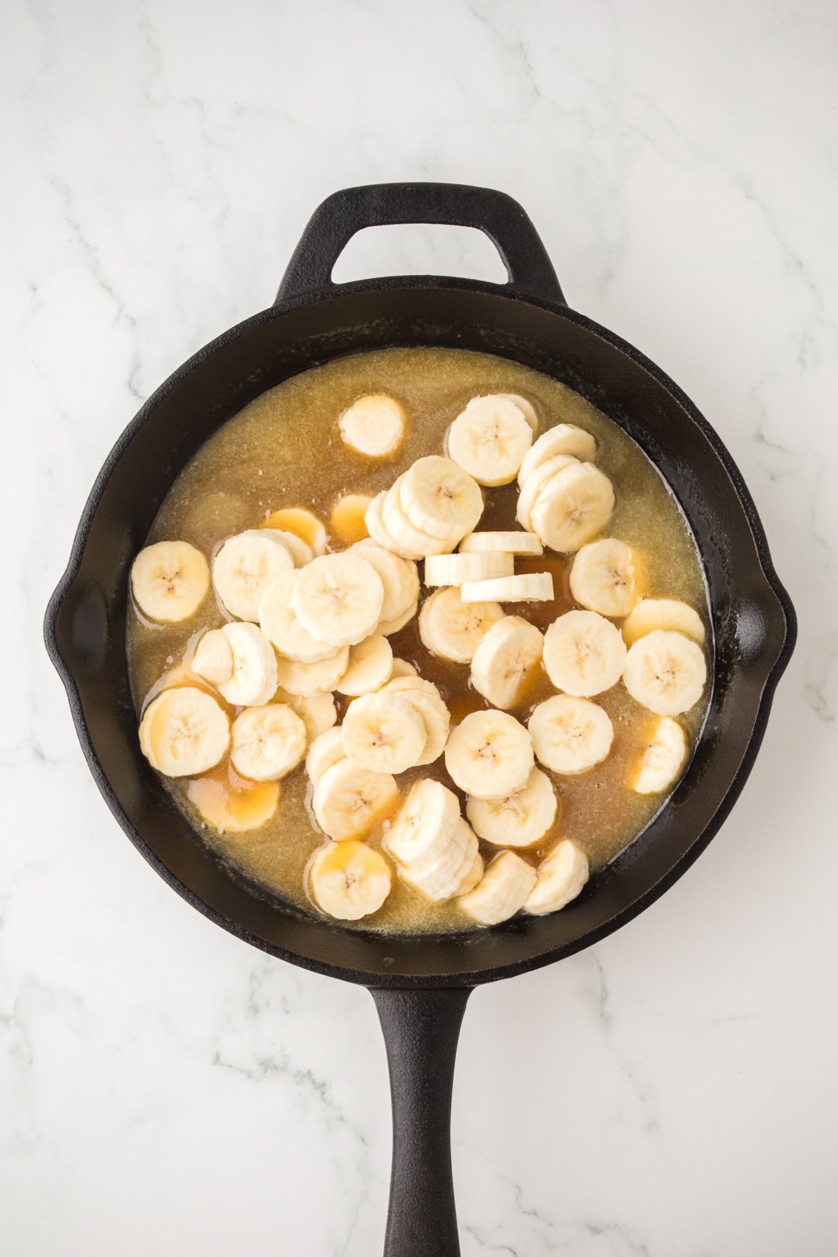Banana slices, vanilla, and rum extract in the syrup mixture.