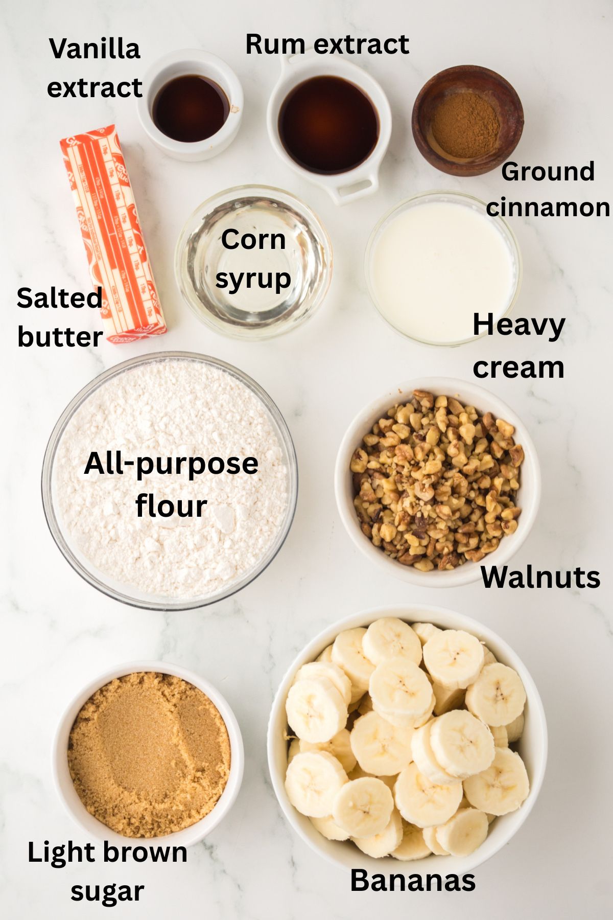 Ingredients for banana cobbler in bowls on a table.