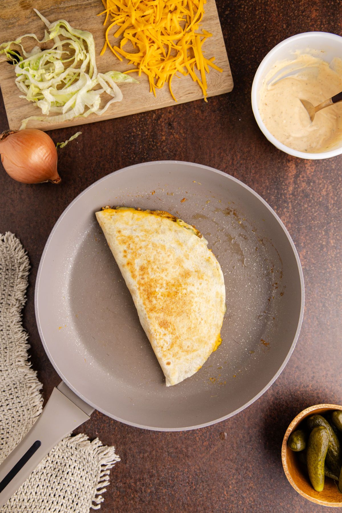 Flip and brown on the other side, and ensure all the cheese is melted.