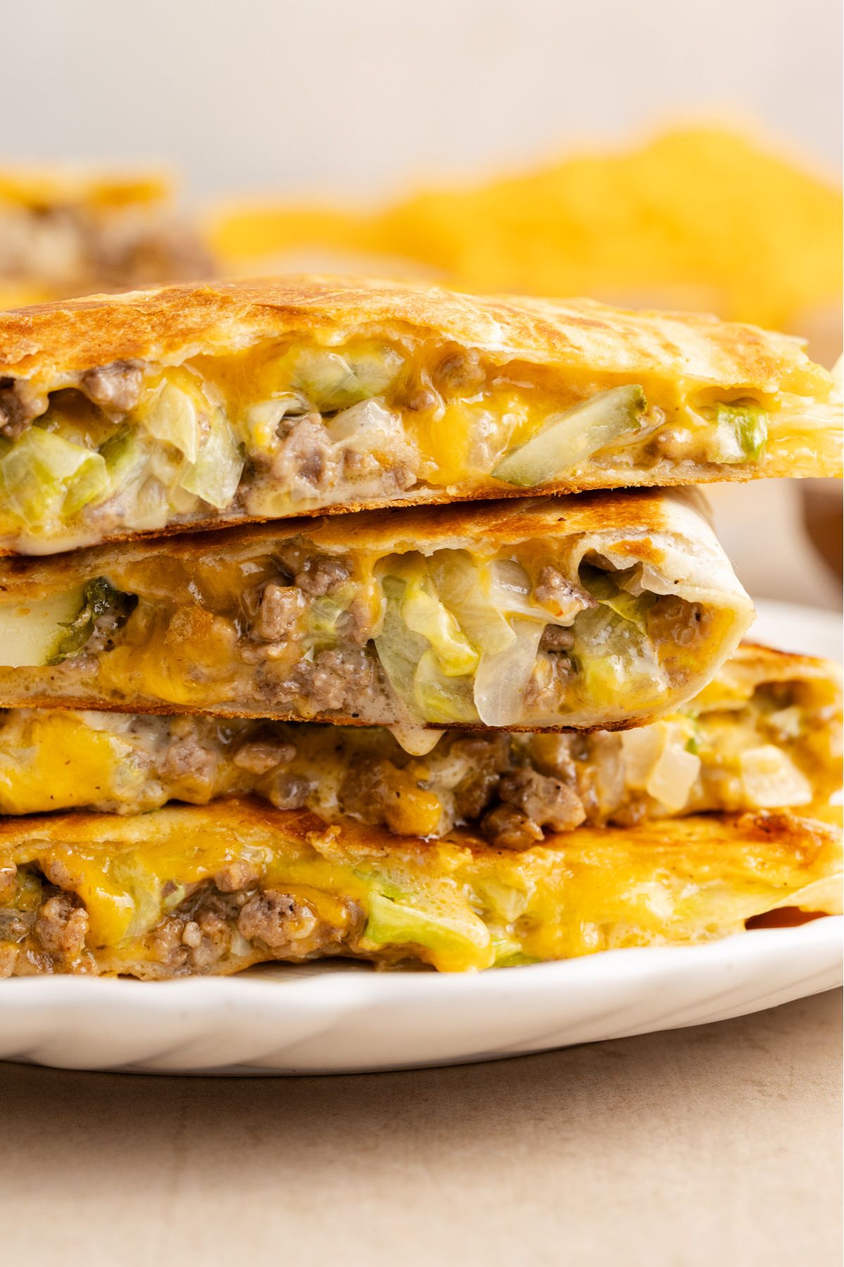 Quesadilla with big mac sauce stacked on a plate.