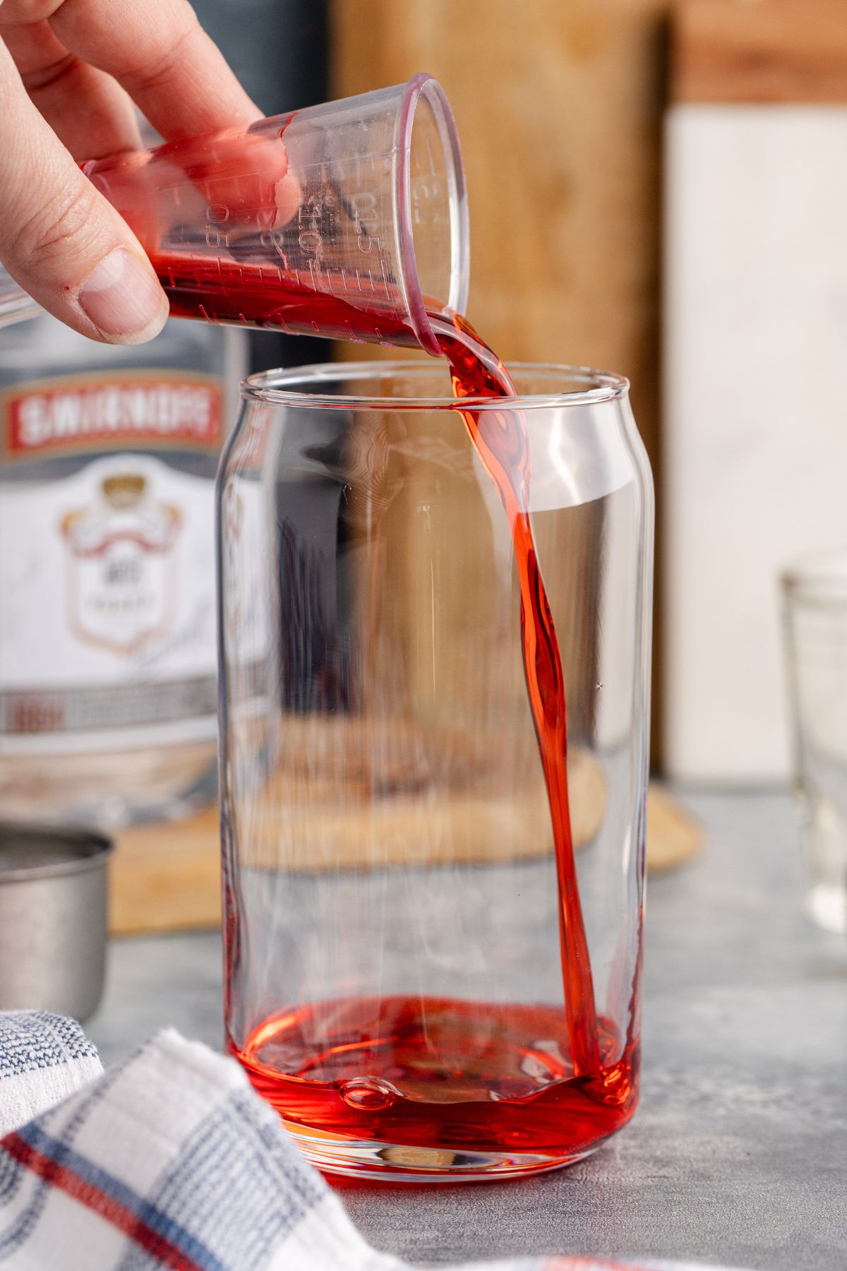 Grenadine being poured into glass.