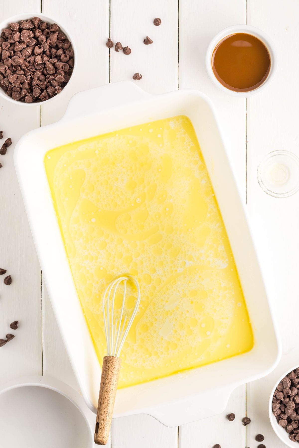 Milk and vanilla extract added into the baking dish.