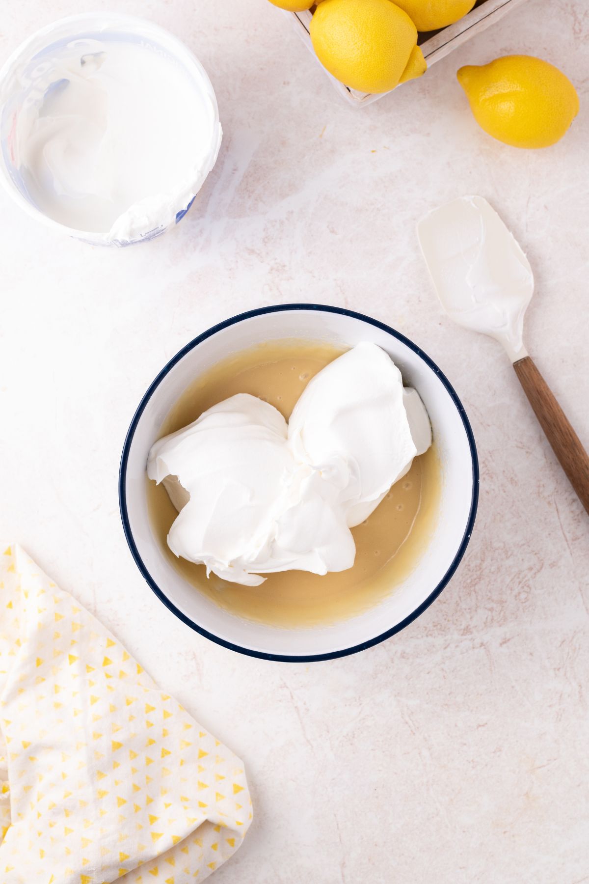 Cool whip folded into the mixture.