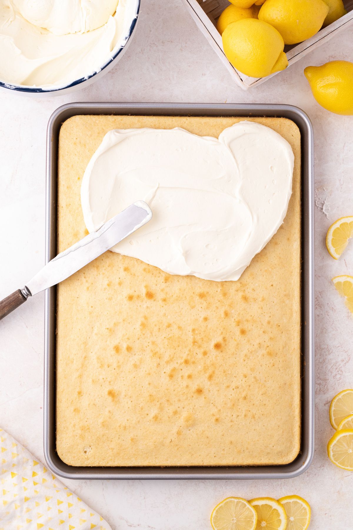 Frosting spread over the top of the cake.