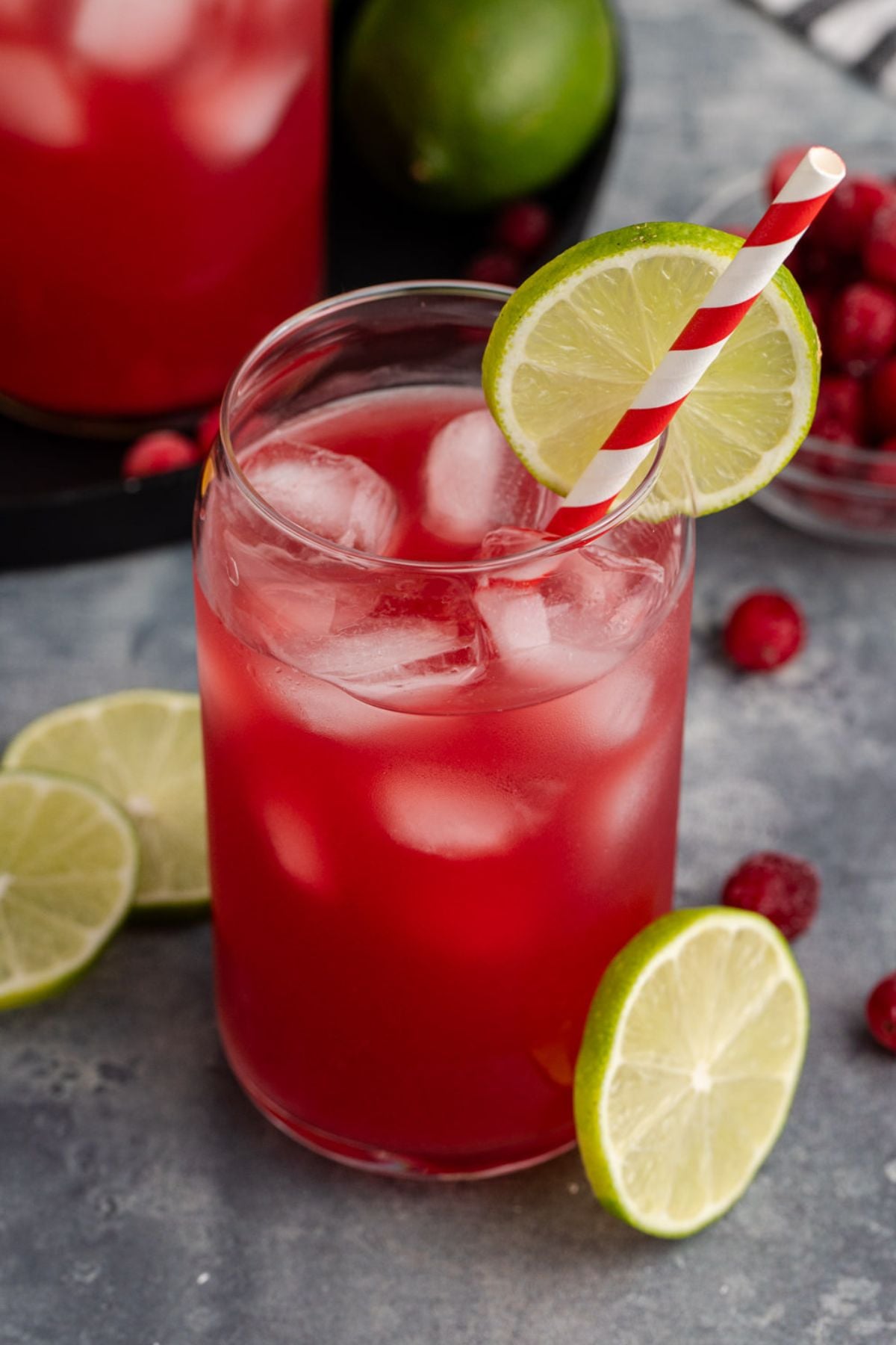 A Cocktail on a table garnished with lime