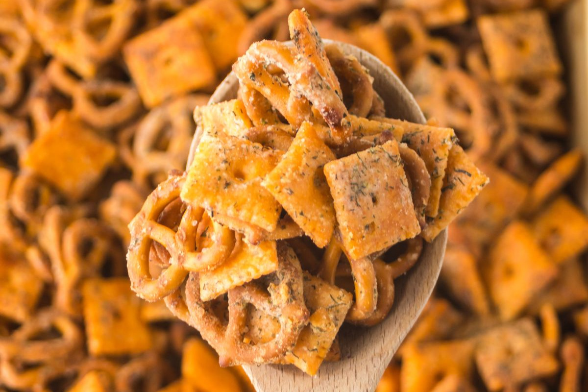 A spoonful of snack mix.