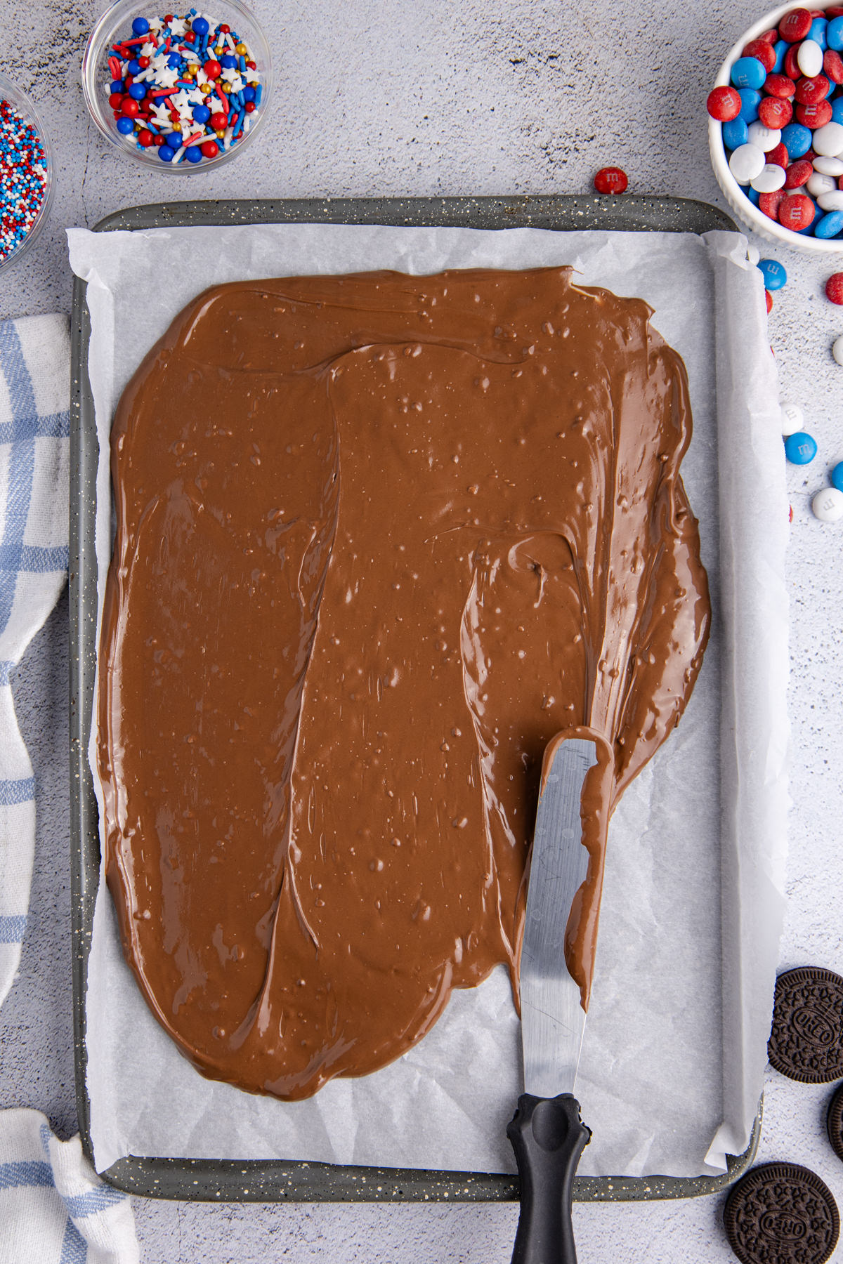 Melted chocolate poured into the prepared pan and spread evenly.