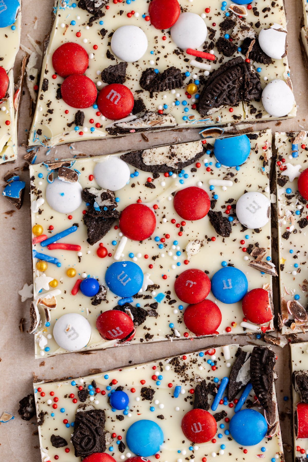A tray of 4th of July bark with chocolate, oreos m&m and sprinkles.