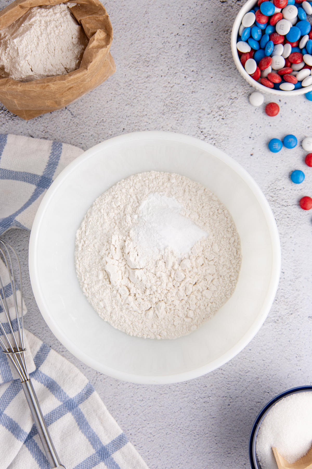Flour, salt, baking powder, and baking soda in a mixing bowl.