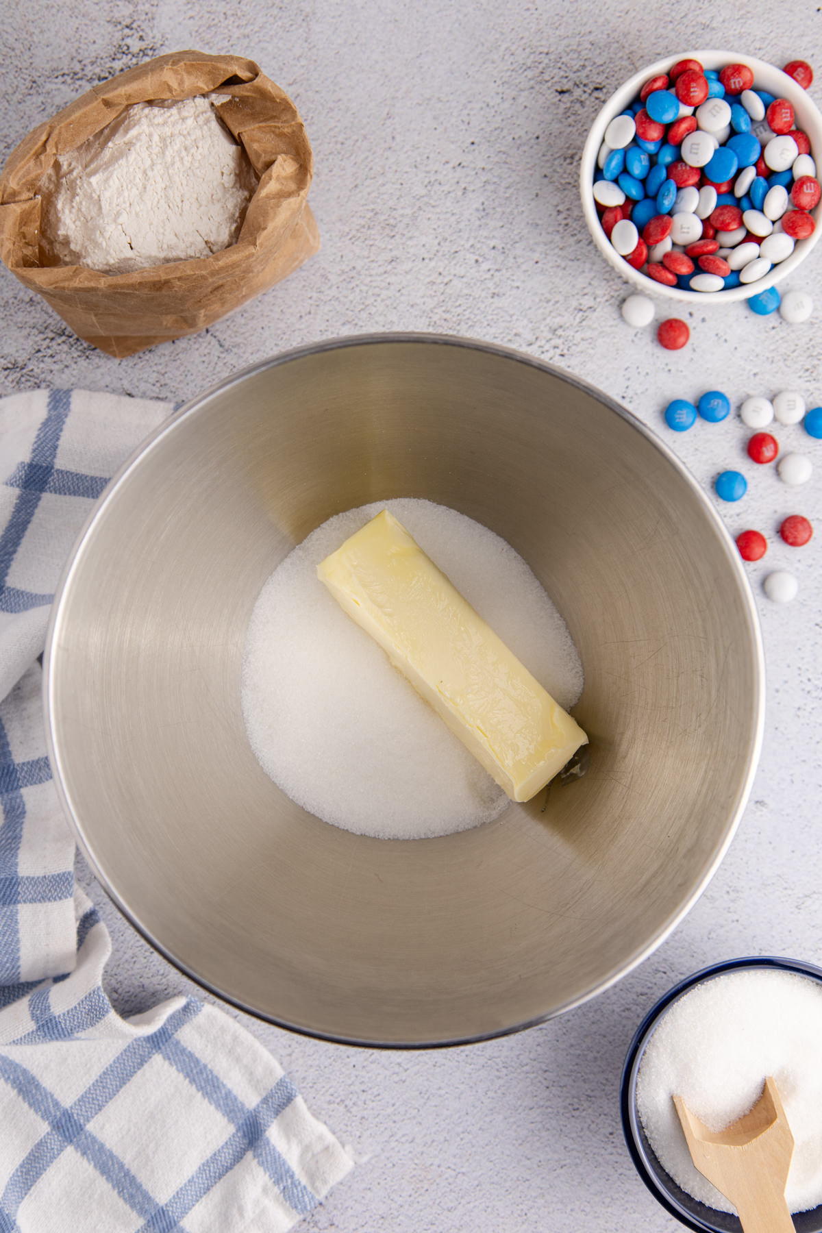 Butter and sugar into the bowl of a stand mixer.
