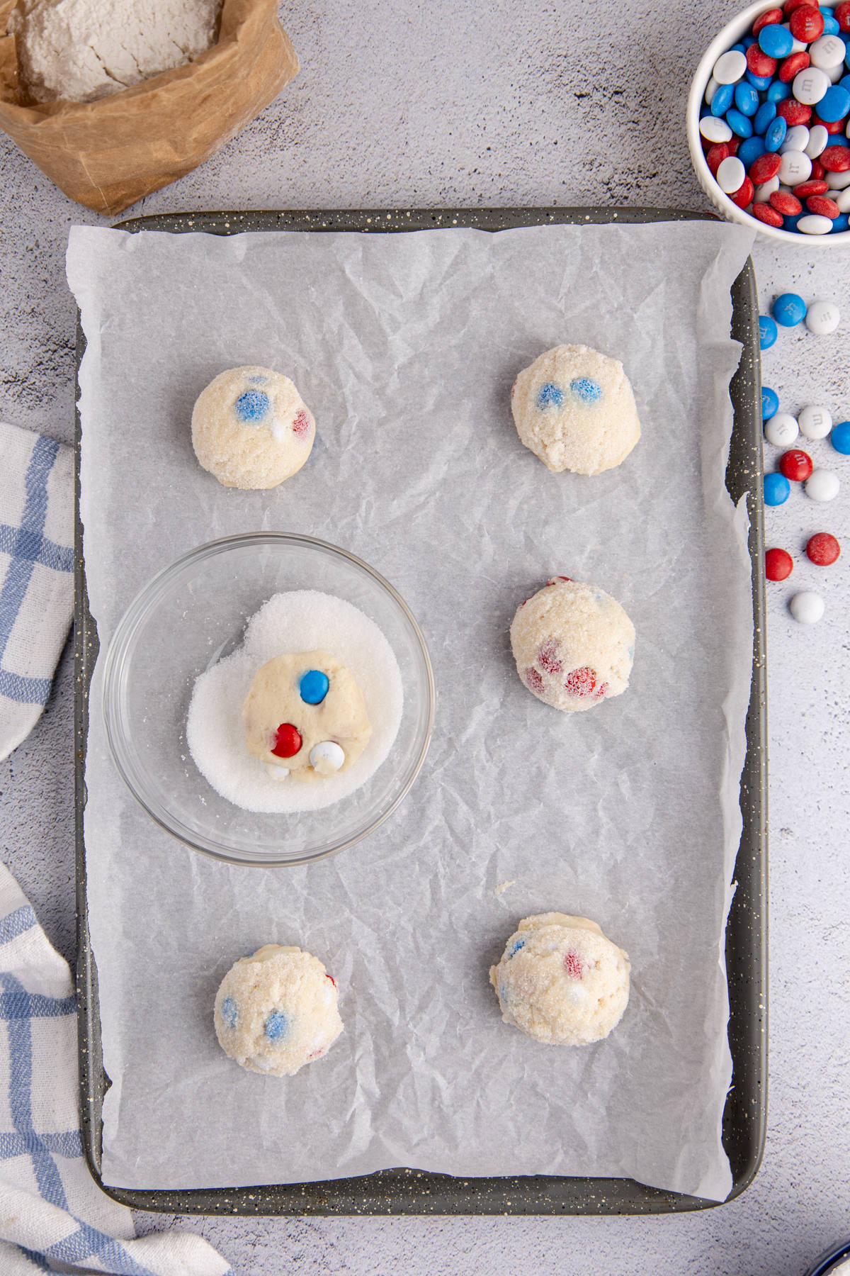 Rolled balls dipped white sugar and place on the prepared baking sheet.