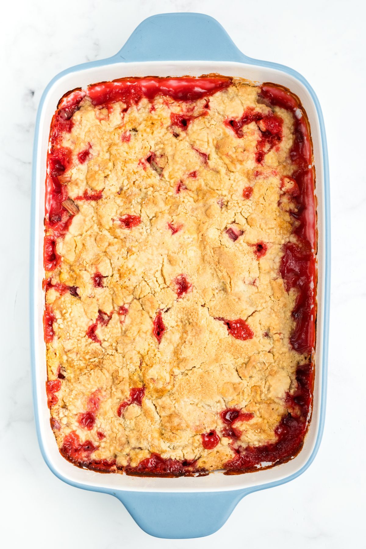 Baked rhubarb cake with golden brown top.