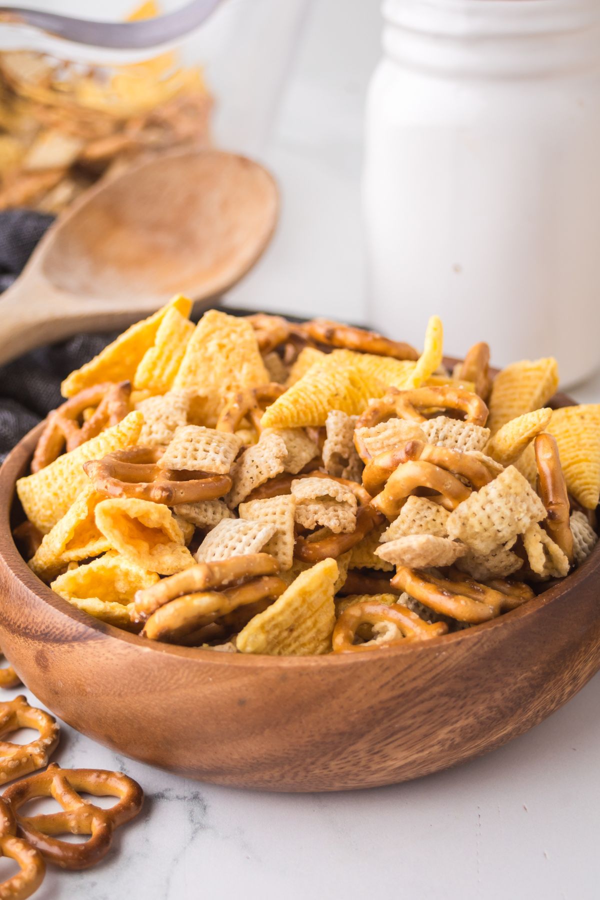 A wooden bowl full of mix on a table