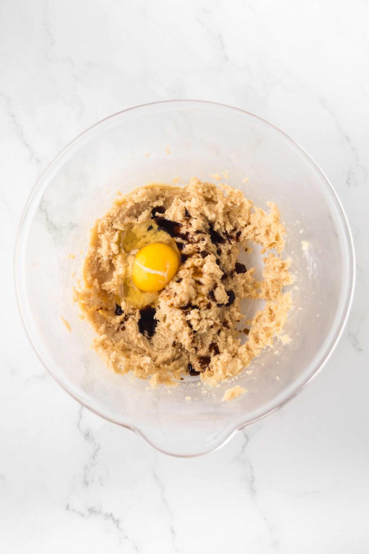 Egg and vanilla extract added to the mixture.