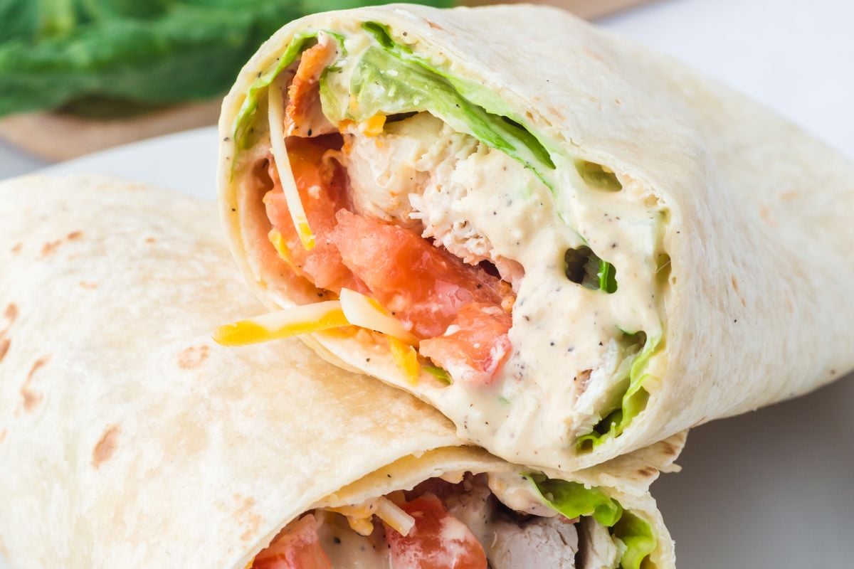A wrap cut in half leaning on each other.