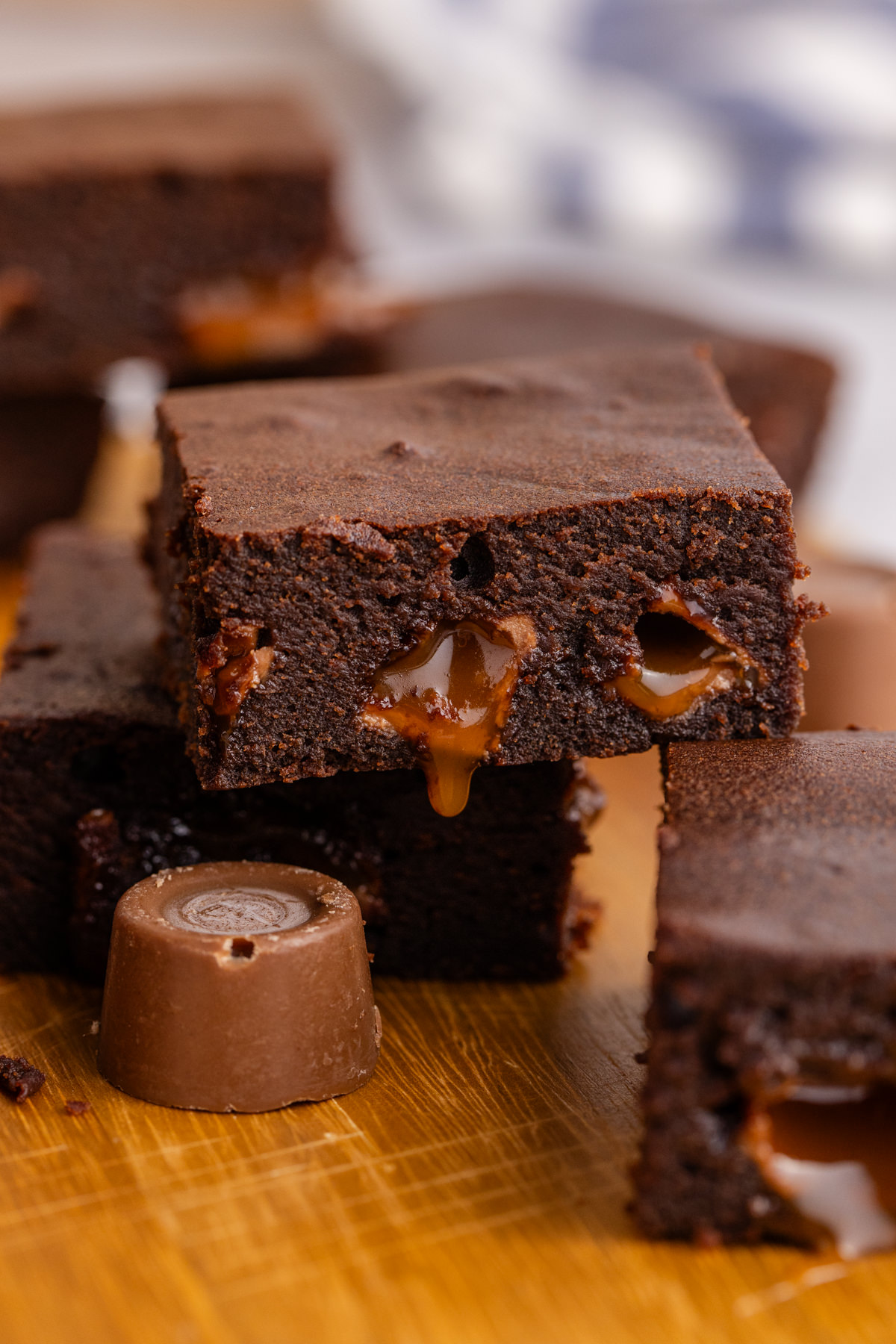 A brownie slice leaning on other slices.