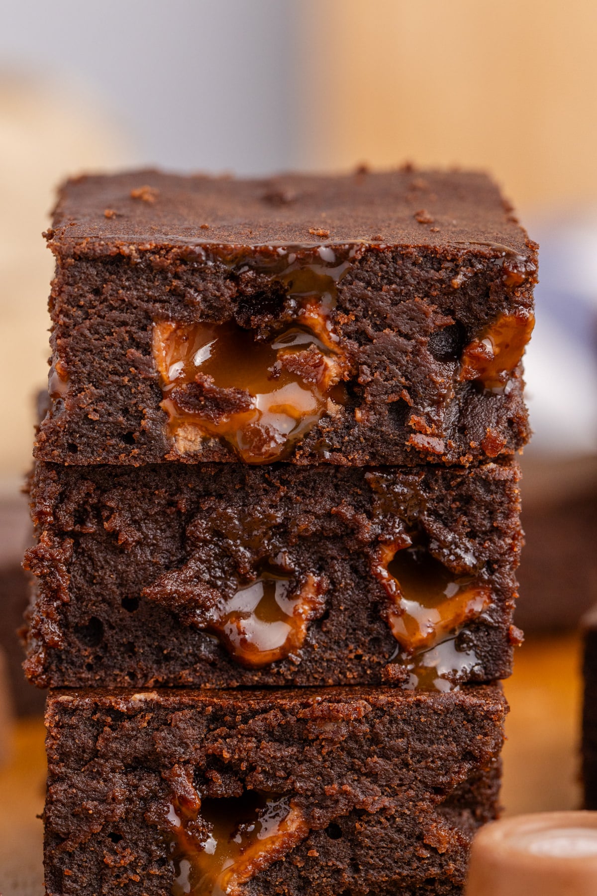 Brownies with rolos in the center stacked on top of each other.