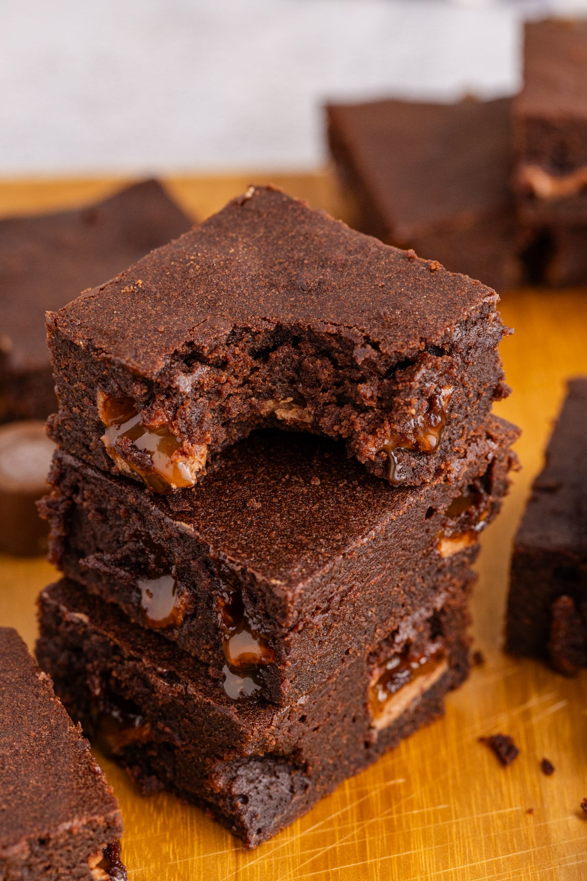 Brownies stacked, and the top brownie bitten.